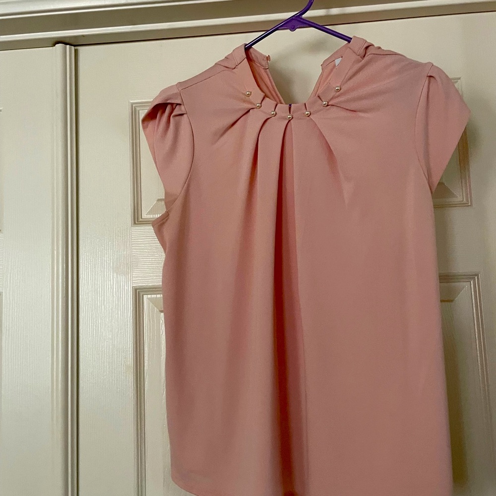 Sweet pink top with pearl accents